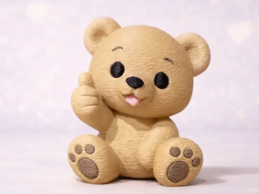 Teddybeer met duim omhoog